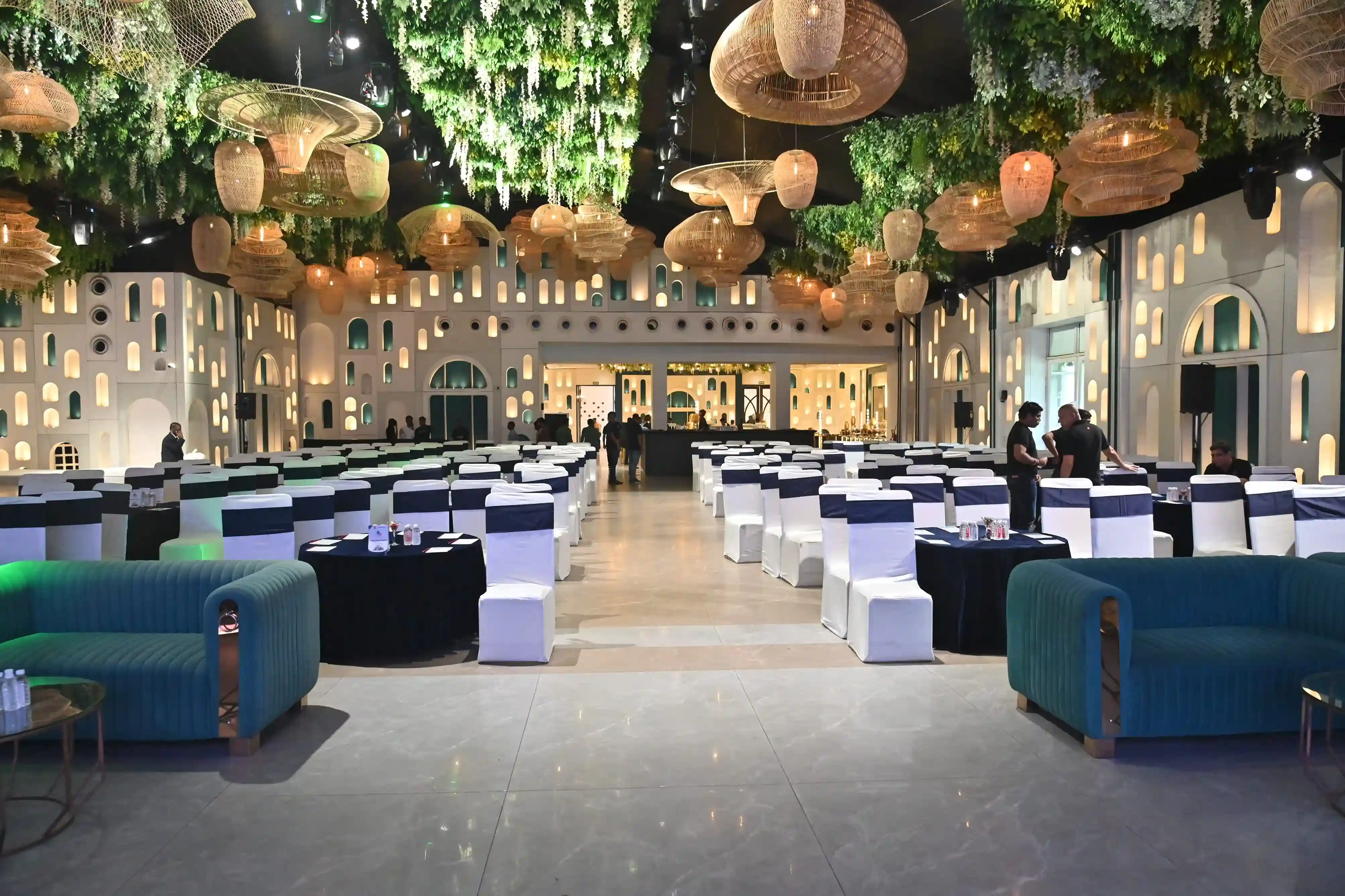 Premium corporate event venue with stage, AV lighting, and banquet seating